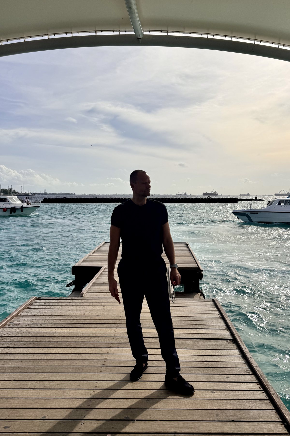 Kristjan Kann on a jetty, looking out to sea